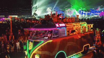 A Colorful Bus With A Vw Logo On It GIF
