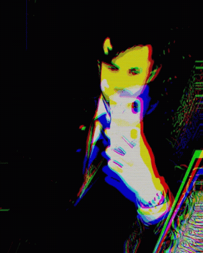 A Colorful Image Of A Man Holding A Cell Phone GIF