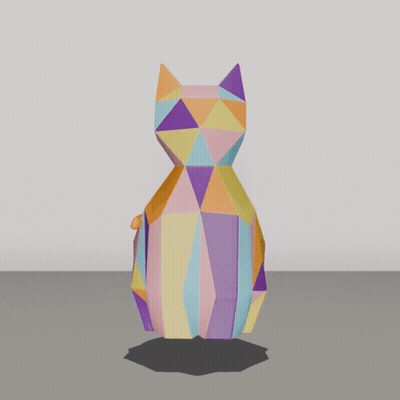 A Colorful Origami Cat Is Sitting On The Ground GIF