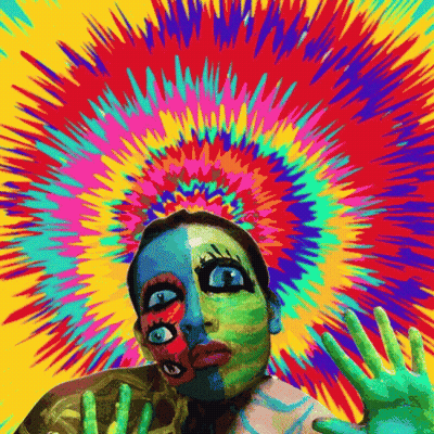 A Colorful Painting Of A Woman 'S Face With A Skeleton In The Background GIF