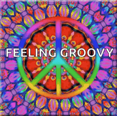 A Colorful Peace Sign With The Words `` Feeling Groovy '' Written Inside Of It GIF