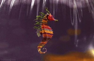 A Colorful Seahorse With A Red Head And Green Tails GIF