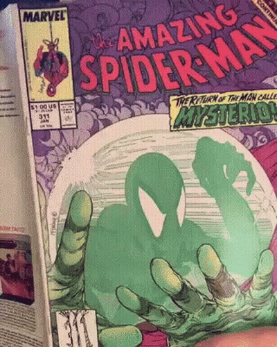 A Comic Book Called The Amazing Spider Man GIF