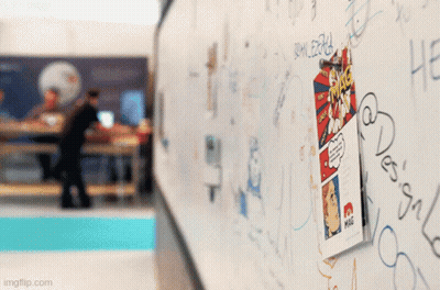 A Comic Book Is Hanging On A White Board With Graffiti On It Including One That Says ' Imgflip.com ' GIF