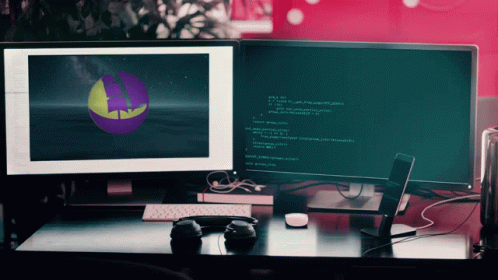 A Computer Monitor Displays A Purple And Yellow Sphere On The Screen GIF