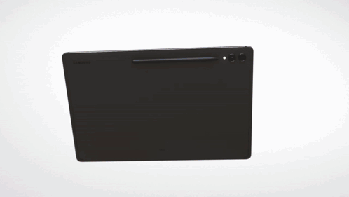 A Computer Monitor Is Displaying A Colorful Image On A White Wall GIF