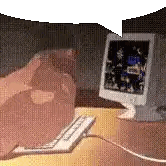 A Computer Monitor Sits On A Desk Next To A Keyboard And Mouse Sticker