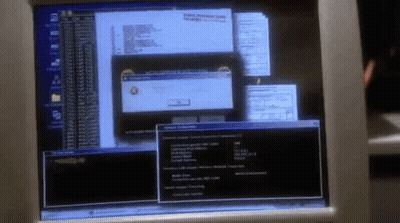 A Computer Monitor With A Few Windows Open Including One That Says Windows Error GIF