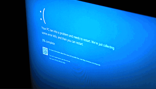 A Computer Screen Displays A Blue Screen That Says " Your Pc Ran Into A Problem And Needs To Restart " GIF