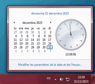 A Computer Screen Shows A Calendar And A Clock On Dimanche 31 Decembre 2023 GIF