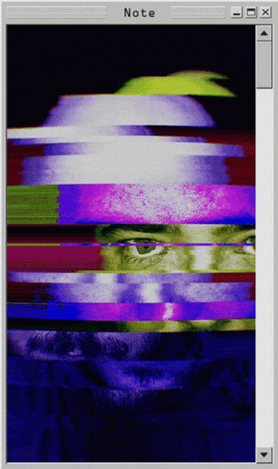 A Computer Screen Shows A Glitch Image Of A Man 'S Face And The Word Note At The Bottom GIF