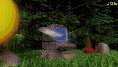 A Computer Sitting In The Grass With The Word Joe In The Corner GIF