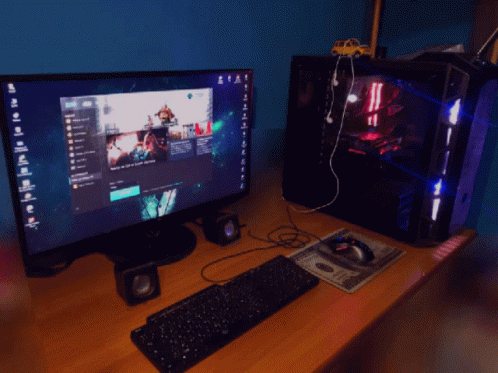 A Computer With A Keyboard And Mouse On A Desk With A Dollar Bill On It GIF