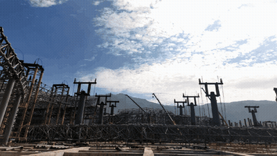 A Construction Site With A Blue Sky Behind It GIF