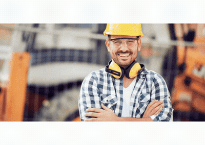 A Construction Worker Wearing A Hard Hat And Ear Protectors GIF
