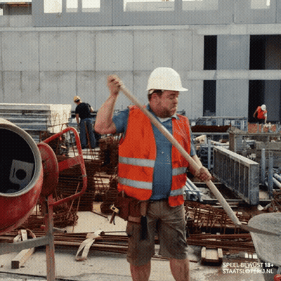 A Construction Worker Wearing An Orange Vest And A White Hard Hat Is Holding A Shovel GIF
