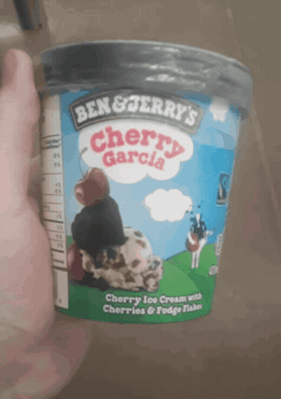 A Container Of Ben & Jerry 'S Cherry Garcia Ice Cream With Cherries And Fudge Flakes GIF