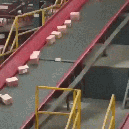 A Conveyor Belt With Boxes On It And One Of Them Has The Number 1 On It GIF