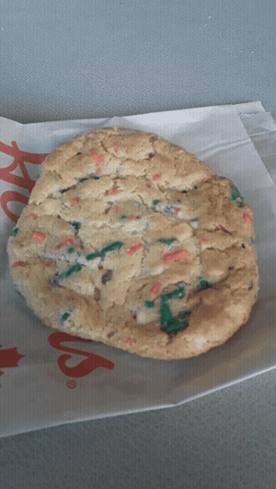 A Cookie Is Sitting On A Piece Of Paper That Says ' Chick-Fil-A ' GIF