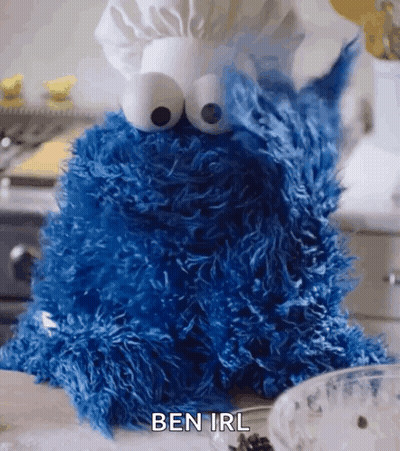 A Cookie Monster Is Sitting On A Counter Wearing A Chef 'S Hat And Saying Ben Irl . GIF