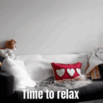 A Couch With A Pillow With Hearts On It And The Words Time To Relax Below It GIF