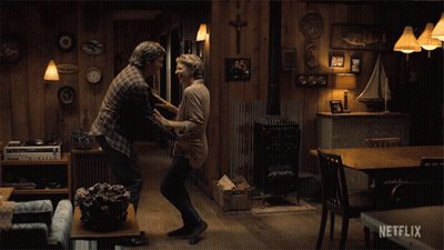 A Couple Dancing In A Living Room With A Netflix Logo On The Bottom GIF