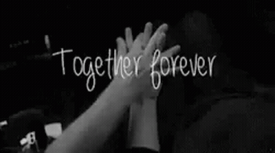A Couple Is Holding Hands In A Black And White Photo With The Words `` Together Forever '' Written On It . GIF