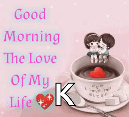 A Couple Kissing In A Cup Of Coffee With A Heart In It GIF
