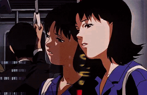 A Couple Of Anime Characters Are Riding A Train Together . GIF
