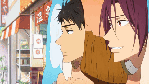A Couple Of Anime Characters Are Standing In Front Of A Store With Chinese Writing On It GIF
