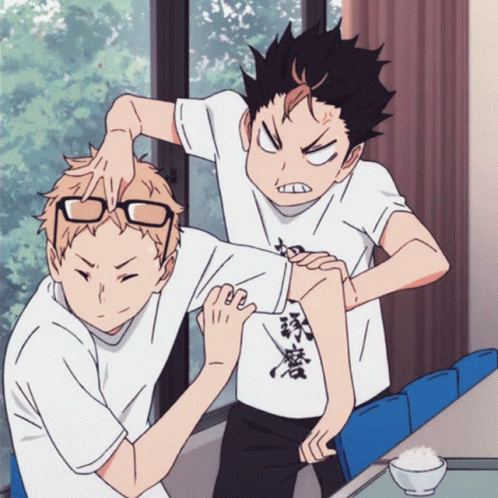A Couple Of Anime Characters One Of Whom Is Wearing A Shirt With Chinese Writing GIF