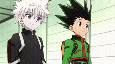 A Couple Of Anime Characters Standing Next To Each Other In A Room . GIF