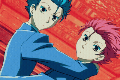 A Couple Of Anime Characters Standing Next To Each Other With A Red Background GIF
