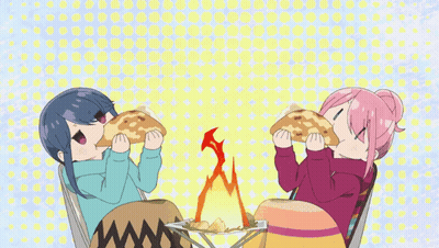A Couple Of Anime Girls Eating Food In Front Of A Fire GIF