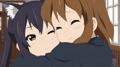 A Couple Of Anime Girls Hugging Each Other With A Cat Ear GIF