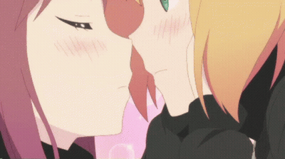 A Couple Of Anime Girls Kissing Each Other With A Pink Background GIF