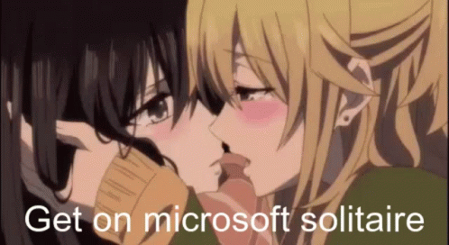 A Couple Of Anime Girls Kissing With The Words `` Get On Microsoft Solitaire '' In The Corner . GIF