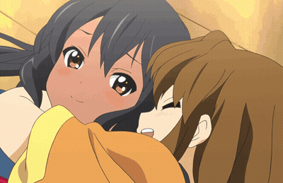 A Couple Of Anime Girls Laying Next To Each Other With One Looking Up At The Camera GIF