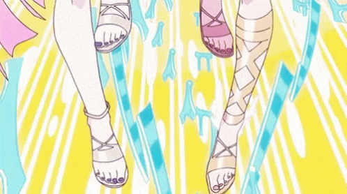 A Couple Of Anime Girls Standing Next To Each Other Pointing At The Camera GIF