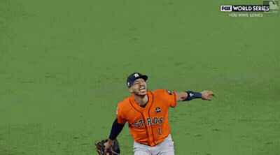 A Couple Of Baseball Players One Of Whom Has The Number 27 On His Jersey GIF
