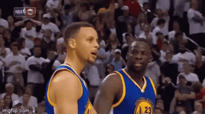 A Couple Of Basketball Players Are Standing Next To Each Other On A Court In Front Of A Crowd . GIF