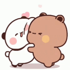A Couple Of Bears Are Hugging Each Other . GIF
