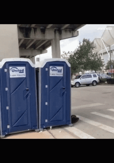 A Couple Of Blue Portable Toilets That Say United GIF