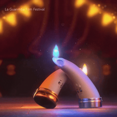 A Couple Of Candles With Faces On Them And The Words La Guarimba Film Festival GIF