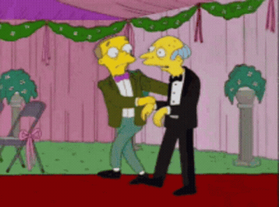 A Couple Of Cartoon Characters Are Standing Next To Each Other On A Red Carpet GIF