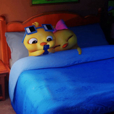 A Couple Of Cartoon Characters Laying On A Bed With One Wearing Sunglasses GIF