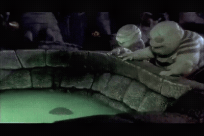 A Couple Of Cartoon Characters Looking At A Glowing Object In The Water GIF