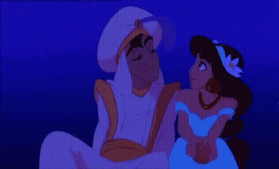 A Couple Of Cartoon Characters Sitting Next To Each Other In The Dark GIF