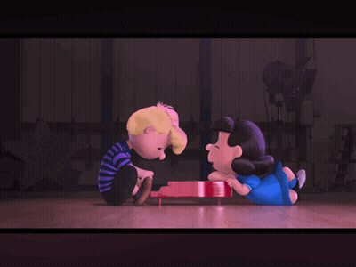 A Couple Of Cartoon Characters Sitting Next To Each Other On A Stage GIF
