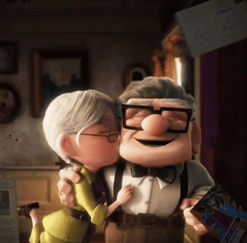A Couple Of Cartoon Characters Standing Next To Each Other And One Of Them Is Wearing Glasses GIF